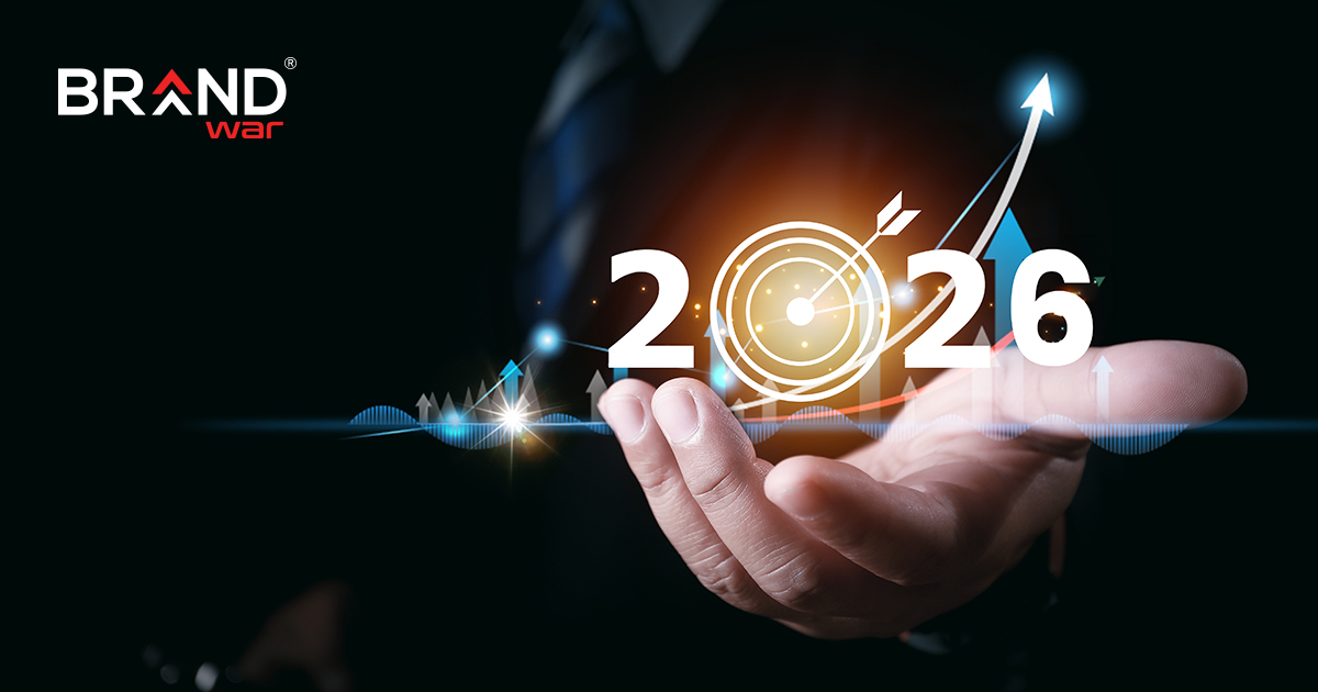 Magnifying glass focusing on '2025 Trends' graphic in front of a laptop, representing upcoming digital marketing trends.